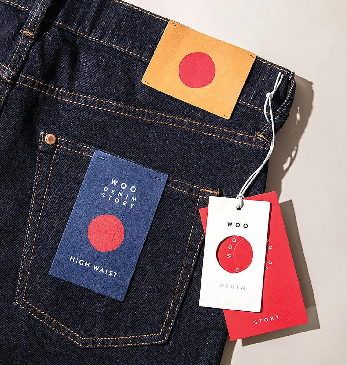 Denim jeans with a leather patch, woven label and swing tags