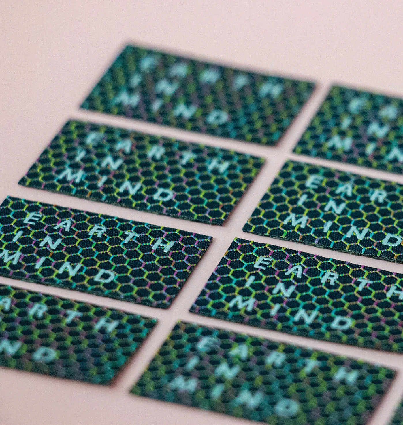 Close-up of recycled polyester space-dyed woven badges